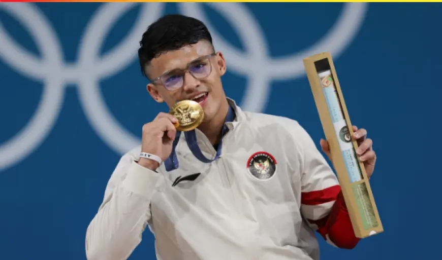 Lifter Rizki Juniansyah Raih Emas Kedua Indonesia di Olimpiade Paris 2024.